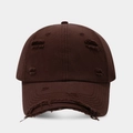 Macro detail of distressed ripped edges on a dark brown cotton baseball cap fabric - Dark Brown