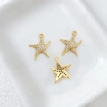 Detail of three 14k gold-plated starfish charms with small crystals for DIY jewelry - 20# Starfish with Zirconia
