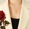 Minimalist gold-plated titanium necklace with a rotating bird relief coin pendant - 40+5cm / Gold