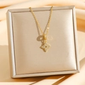 Collana a quadrifoglio in titanio dorato con pendente in pavé di diamanti su seta - Stile Fiore a Quattro Foglie Con Nappa Pavimentato (8511)
