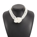 Close-up of elegant three-layer pearl necklace with an intricate central knotted design - Triple-Layer Interwoven Pearl Knot Style (N11729) / White