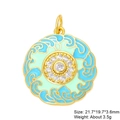 Macro shot of circular enamel charm with blue and green patterns and inlaid zircons - Green Blue Cloud