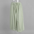Detail of light green cotton lantern pants with elastic drawstring waist and loose fit - S / Green
