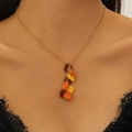 Detailed view of autumn maple leaf pendant necklace featuring orange and brown resin charms - Necklace (02 KC Gold DZ-098)