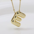 Detailed close-up of a 3D bubble letter E pendant in gold finish with a bead chain necklace - Letter E (Necklace)