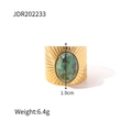 Macro detail of vintage gold oval turquoise ring with radiant sunburst textured patterns - Wide Band Sun Pattern Green Stone Style (JDR202233)