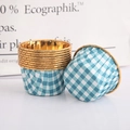 Close-up of heat-resistant blue and white checkered cupcake liners with elegant gold rims - Single-sided Gold Blue Plaid