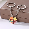 Macro view of burger and fries magnetic heart pendants with Best Friends engraving - Two-Piece Set / Burger Keychain