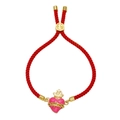 Macro shot of red braided rope bracelet with pink enamel heart pendant and gold crown - Red