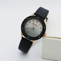 Modern quartz watch with black leather strap and rose gold wavy pattern dial for women - Black