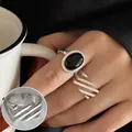 Vintage silver ring set featuring large black gemstone and wavy textured open band style - Oval Black Agate/Diagonal Wave