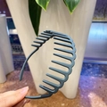 Detail of greyish-blue matte headband featuring anti-slip inner teeth design for women - Light Gray