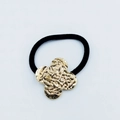 Black elastic hair tie with golden clover leaf alloy ornament and embossed texture - Four-Leaf Clover Embossed Hair Tie (Model 83)