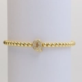 Detail of gold beaded bracelet featuring a micro-pave zircon letter Q bubble pendant - Letter Q
