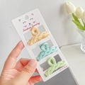 Three-piece set of matte small hair claws in light yellow, teal, and light green shades - Blue Series - Twist