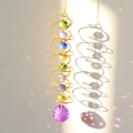 Detail of 3D spiral wind spinner with colorful crystal spheres casting rainbow reflections - Gold Spiral Purple Crystal Ball