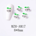 Close-up of 8x8mm 3D cherry nail charms with silver metal, green leaves and rhinestones - Silver Base Medium Clear Cherry (AM17)