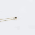 Minimalist gold square necklace with black cube pendant featuring the letter C engraving - C