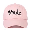Close-up of pink baseball cap featuring black Bride script embroidery on cotton fabric - Bride (BRIDE) / Pink