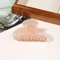 Macro detail of iridescent pearly pink resin hair claw clip with a glossy finish - PVC 8cm Square Head - Iridescent Orange
