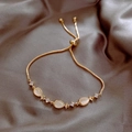 Detail of adjustable gold bracelet featuring fish-shaped cat eye stones and sparkling zircons - Gold Fish-shaped Cat Eye Stone Decor Style (55#)