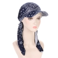 Detail of blue printed headscarf with brim and long straps on a model, soft fabric - Navy Paisley