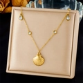 Detailed view of a gold-plated shell pendant necklace with teardrop and round gemstones - Shell Pendant With Transparent Gemstones (N3490)