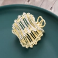 Elegant gold hair claw clip with sparkling rhinestones for high ponytail styles - Gold