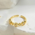 Macro shot of gold-plated adjustable chain ring with four round-cut cubic zirconia stones - Chain Style Round Zirconia / White Zirconia