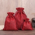 Three-piece red burlap drawstring jewelry pouches in small, medium and large sizes - Burgundy