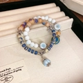 Blue and purple beaded bow bracelet with silver floral accents in a luxury gift tray - Style 100 Bracelet / Blue & Purple