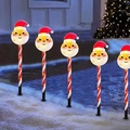 Solar Christmas Santa pathway lights with red striped poles for festive outdoor garden decor - Battery Box / Santa Claus