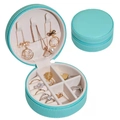 Light blue round travel jewelry box with zipper and interior compartments for rings - Blue