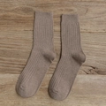 Women's light brown cotton mid-calf socks with ribbed texture on a rustic wooden background - Coffee