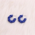 Exaggerated C-shaped blue twisted matte acrylic hoop earrings for women on white fur - Small Royal Blue Twisted