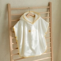 Hooded cotton baby bath towel poncho with yellow duck embroidery on wooden rack - Three Ducks