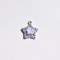 Detailed view of a silver star pendant with a pink opal flower and sparkling crystals - Purple
