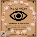 Pink zebra jasper beads bracelet with evil eye lucky charm on vintage card - Red Network Stone