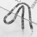 Macro detail of marble-patterned acrylic chain links with silver metal lobster clasps - Dark Grey Marble