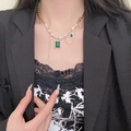 Vintage gold chain pearl necklace with emerald green crystal pendant worn on model - Emerald Style Zirconia Tassel Necklace (X4881)