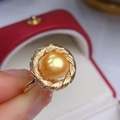 Elegant gold-tone ring featuring a large golden freshwater pearl on a twisted band - 8-9MM / Gold