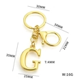 Golden metal letter G keychain with lobster clasp and detailed size measurements - Letter G