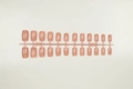 Detail view of 20 pieces solid nude matte square long press-on nails on plastic frame - Nude Pink