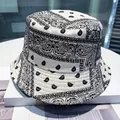 Reversible bucket hat featuring black and white paisley pattern on durable twill cotton - Paisley Bandana (White)