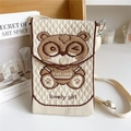 Detail of knitted mini crossbody bag with cartoon bear and beige textured diamond pattern - Glasses Bear Beige