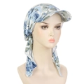 Detail view of floral turban hat featuring blue and green patterns with lightweight fabric - White Blue Big Flowers