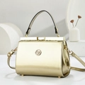 Elegant champagne gold doctor bag with glossy finish and metal frame handle - Patent Leather Gold