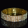 Macro shot of gold four-row rhinestone bridal stretch bracelet with mirror reflection - 4 Row Gold Clear Rhinestone Bracelet