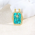 Macro detail of a golden tarot charm featuring teal enamel and a zircon North Star - Blue-Green North Star Style (ZYN-DMK872G-2)