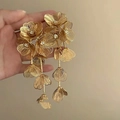 Close-up of golden multi-layer hollow flower earrings with tassel and rhinestones - Hollow Flower Rhinestone Tassel (16#)
